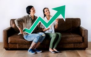 women-sitting-on-couch-and-holding-statistics