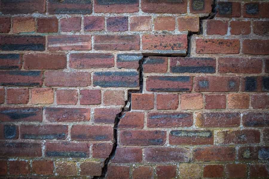 A large crack in a brick wall caused by subsidence