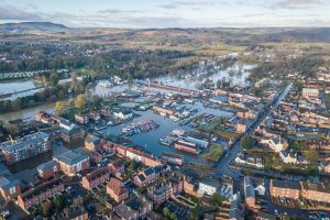A village partially submerged under flood water due to climate change