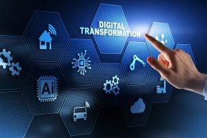 A hand points to a holographic image with the words 'digital transformation' and a series of business and legal symbols