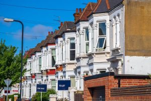 house prices reflected via image of english housing