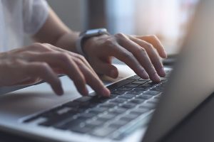 Image of a person on a laptop
