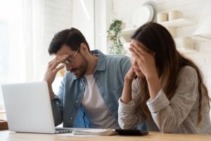 Image of two stressed people