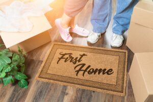 A doormat with the words 'first home'