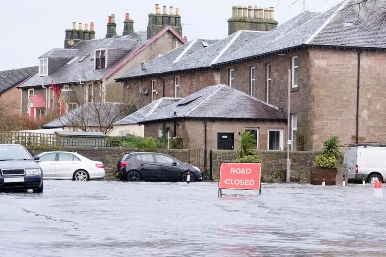 A row of terraced houses on a flooded street