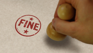 A stamp with the word 'fine' stamped in red on white paper
