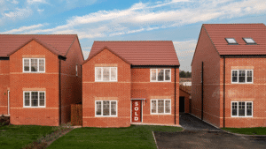 A new-build house with a sold sign covering the door