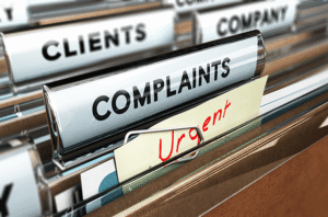 A draw containing files marked 'complaints', 'clients' and 'urgent'.