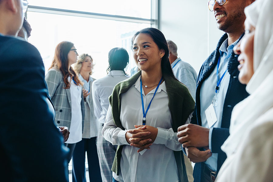A group of young and diverse business people in conversation
