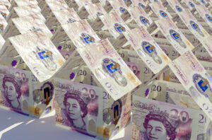 Rows of houses made out of folded £20 notes