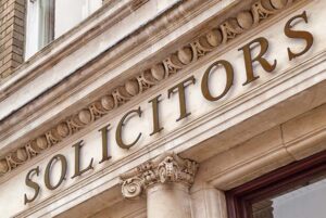 Signage on an exterior wall saying 'solicitors'