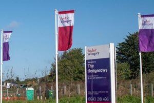 Flags on a Taylor Wimpey housing development