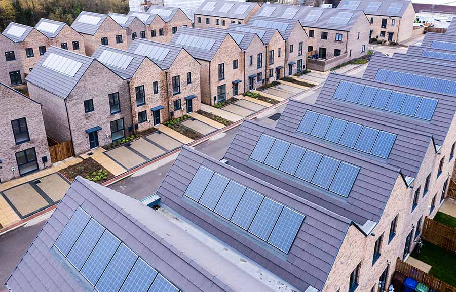 Rows of identical new houses all with solar panels