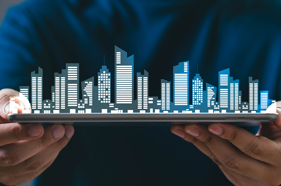 A graphic of a city depicted in white lights, appearing to be rising in 3D from a hand-held tablet