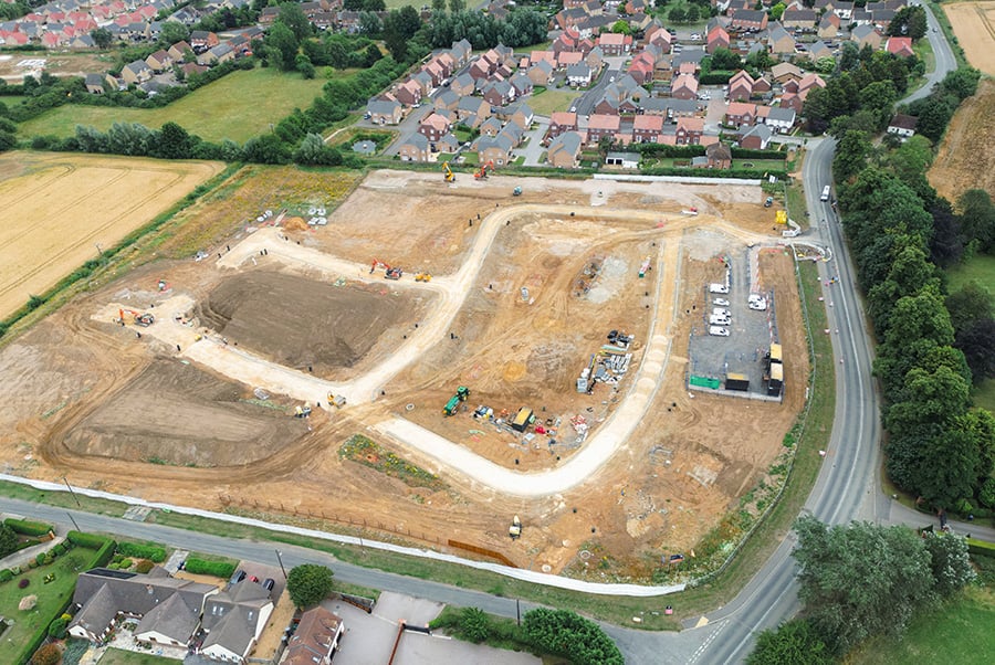 An expanse of cleared land prepared for a residential development