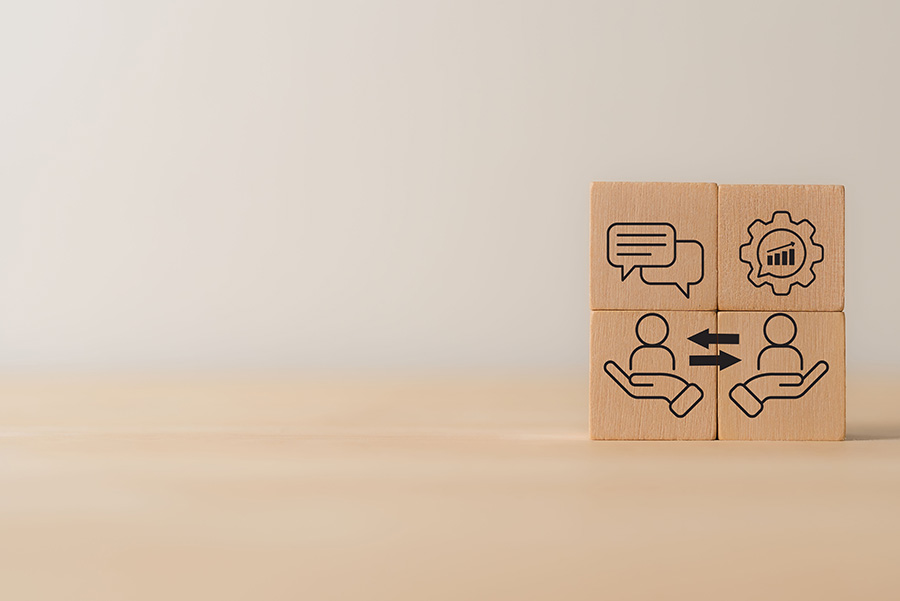 Four blocks with simple illustrations of people talking and speech bubbles