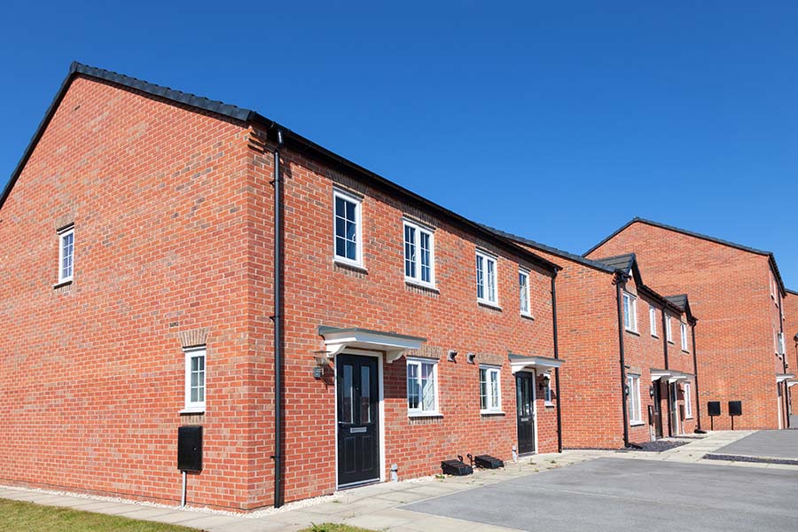A row of new, unoccupied, affordable homes