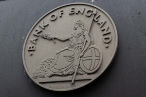 A round 'Bank of England' sign on the outside of the building