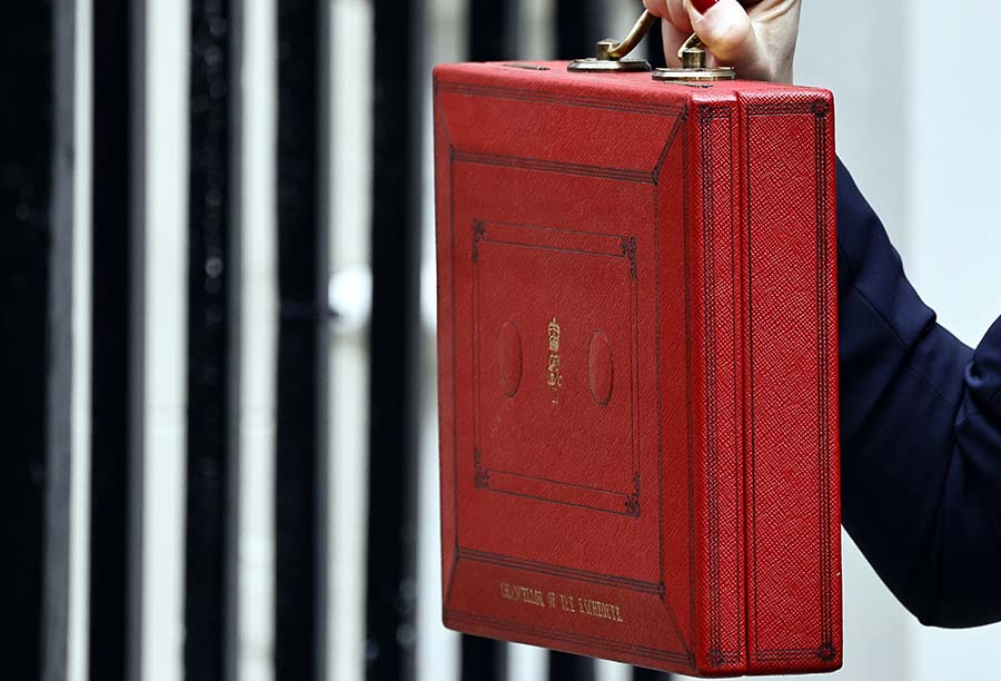 The chancellor holds up the red budget briefcase