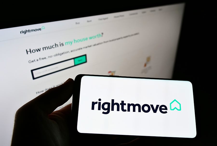 Rightmove websites open on a computer screen and phone screen