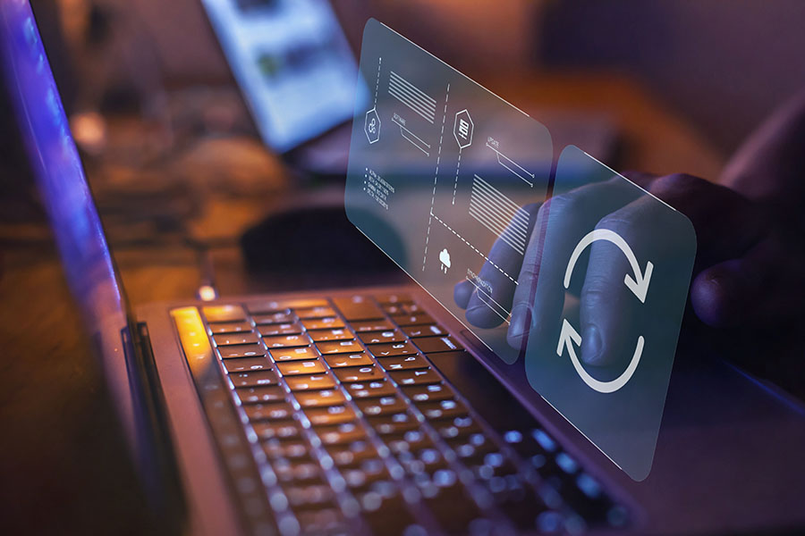 A graphic of of computer files is overlaid on an image of a laptop keyboard