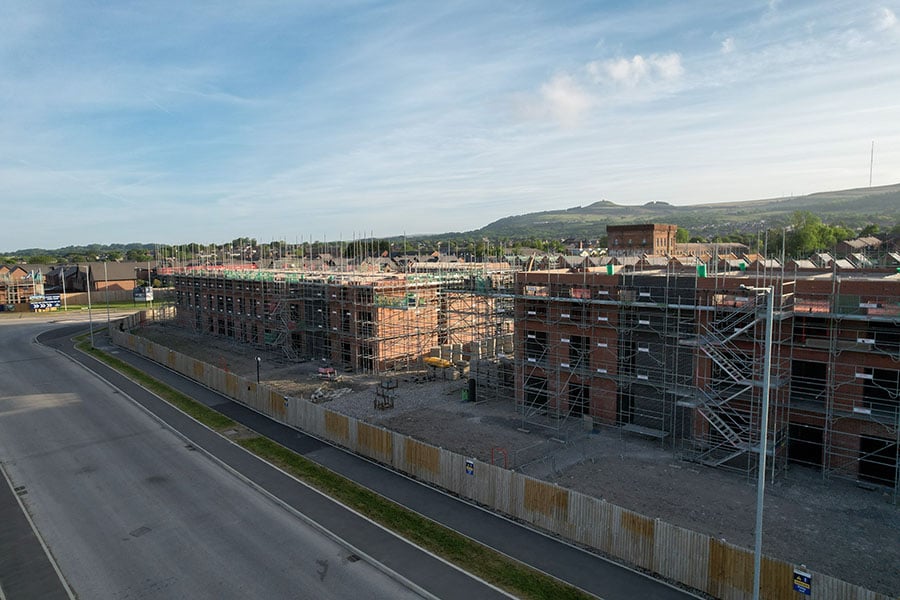 A large newbuild development of flats and houses surrounded by countryside