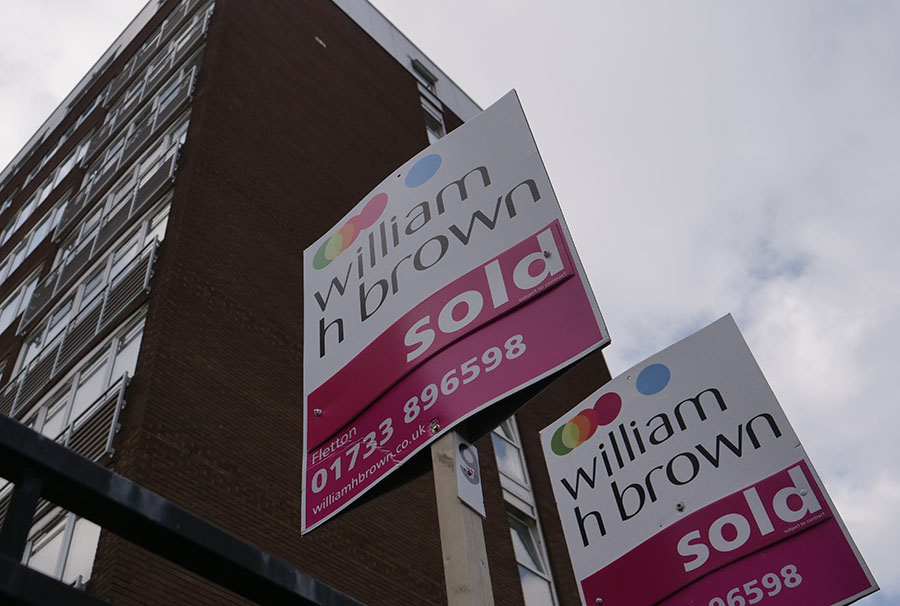 Sold signs outside a block of flats