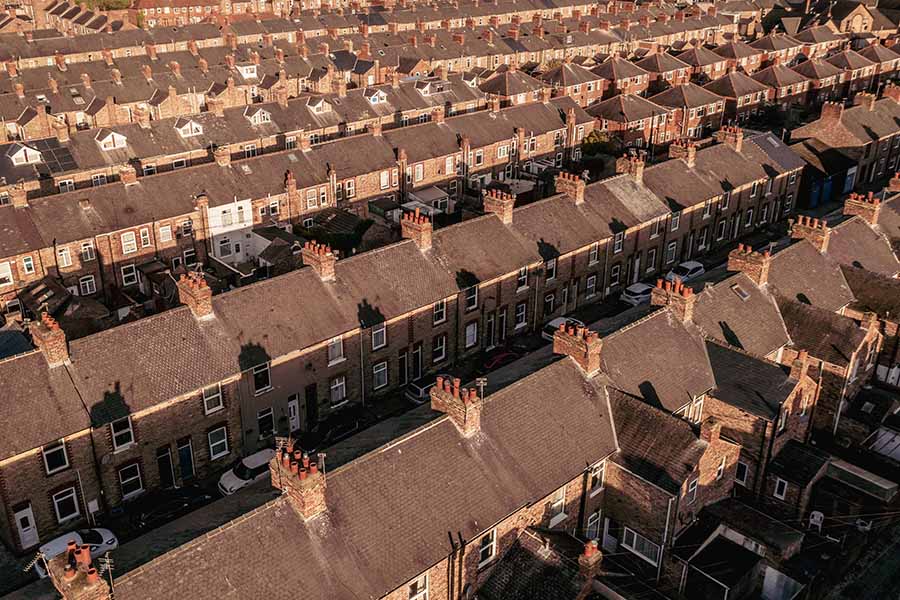 Rows of terraced houses, partly in shadow
