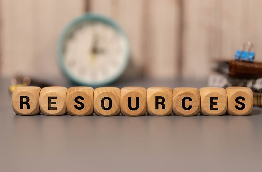The word resources spelled out on wooden cubes