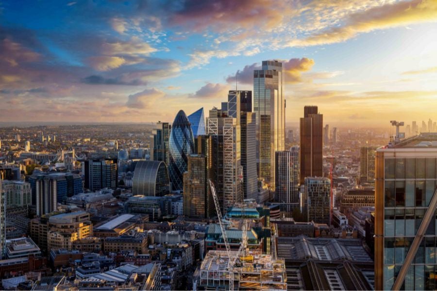 Elevated view of the City of London skyline with dramatic clouds