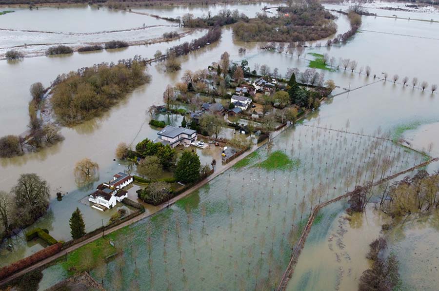 An aerial view of a flooded village in England