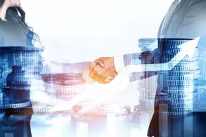 A clos up of a man and woman shaking hands, with a graphic overlaid of coins and a graph with an upwards trajectory