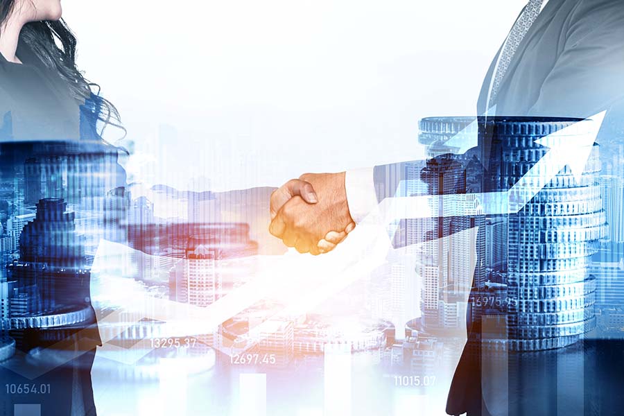 A clos up of a man and woman shaking hands, with a graphic overlaid of coins and a graph with an upwards trajectory