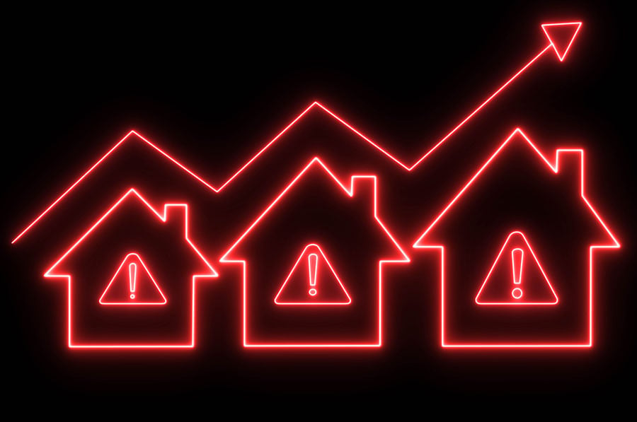 Outlines of three houses in red neon, with warning signs in the middle