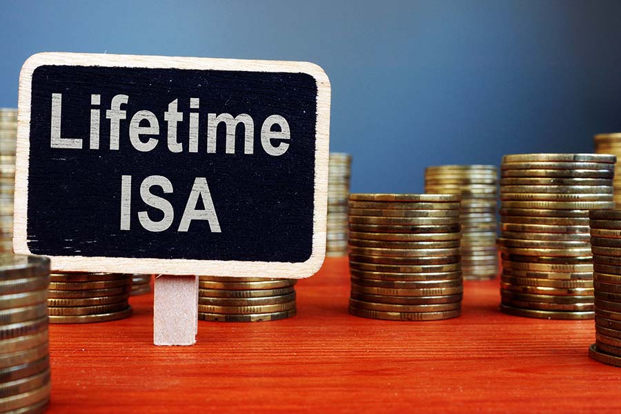 A sign with the words 'lifetime isa' surrounded by piles of coins