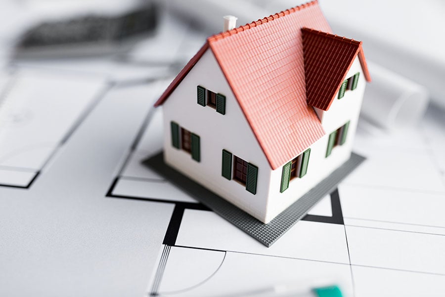 A model house placed on a planning map