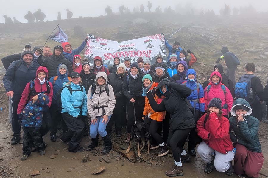 A group photo of the women at the snowdon summit
