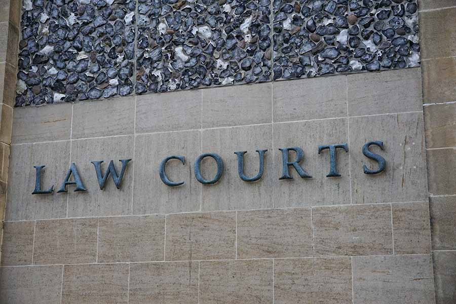 A 'Law Courts' sign on the exterior of a building