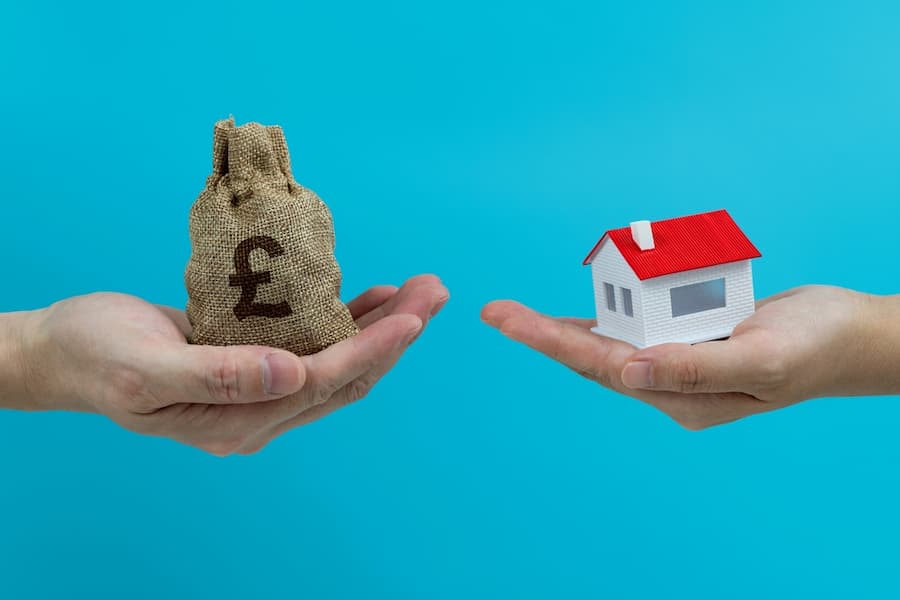 Money change house on blue background