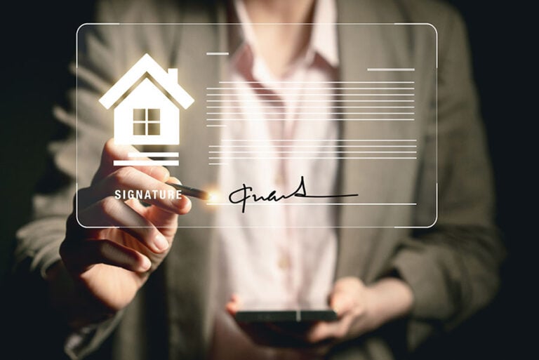 A woman holds out a pen appearing to write on an overlaid graphic of a house and lines of text