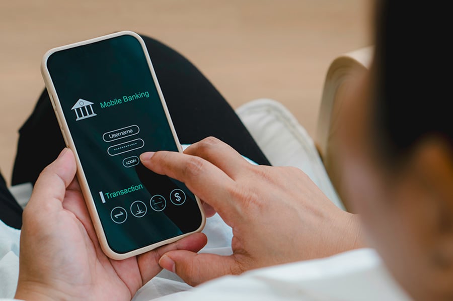 A person using a banking app on their phone