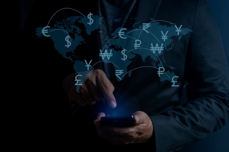 Man using smartphone with online financial transactions for overseas spending