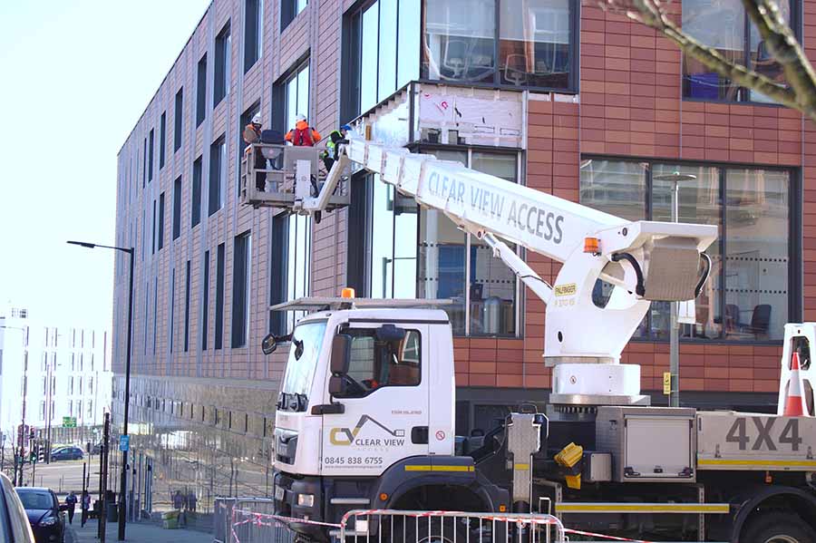 Cladding being removed from a building