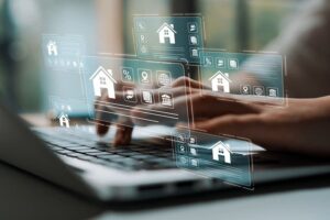 Digital interaction with real estate icons on a laptop, showcasing modern technology and online property search concept