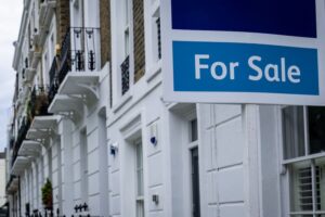 Estate agent 'for sale' sign on attractive London street