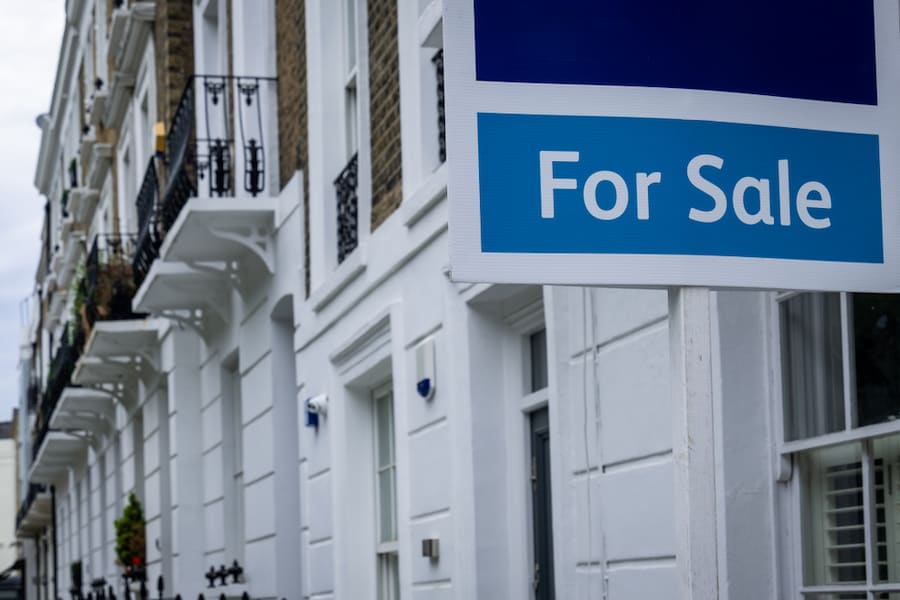 Estate agent 'for sale' sign on attractive London street