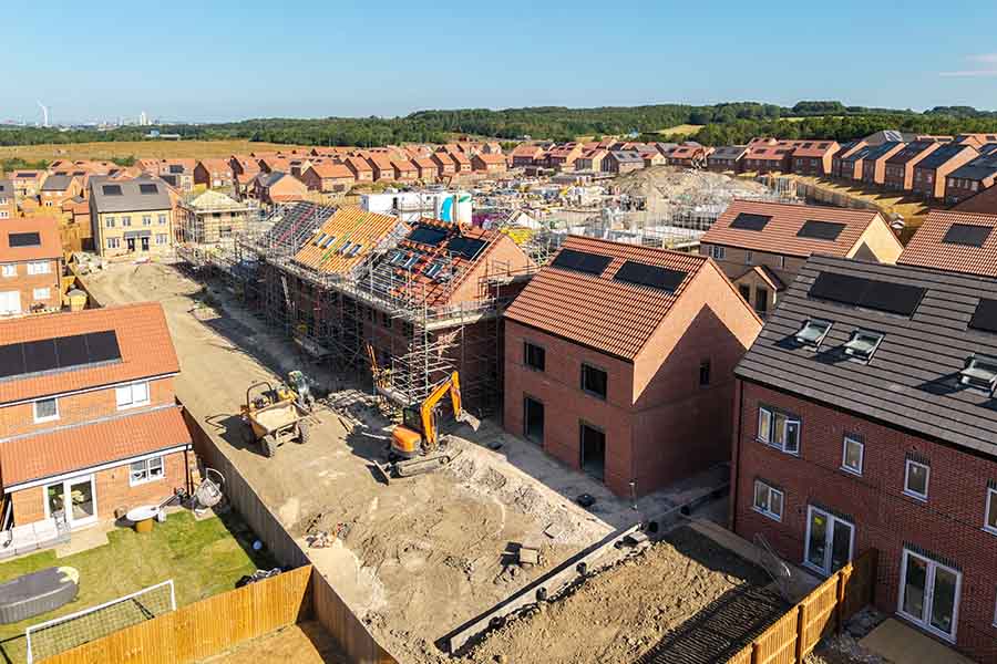 An aerial view of a large new affordable homes development under construction
