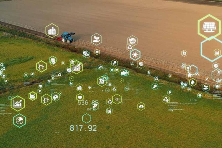 An overlaid graphic of multiple symbols depicting housing, tech and other sectors is overlaid a large agricultural field