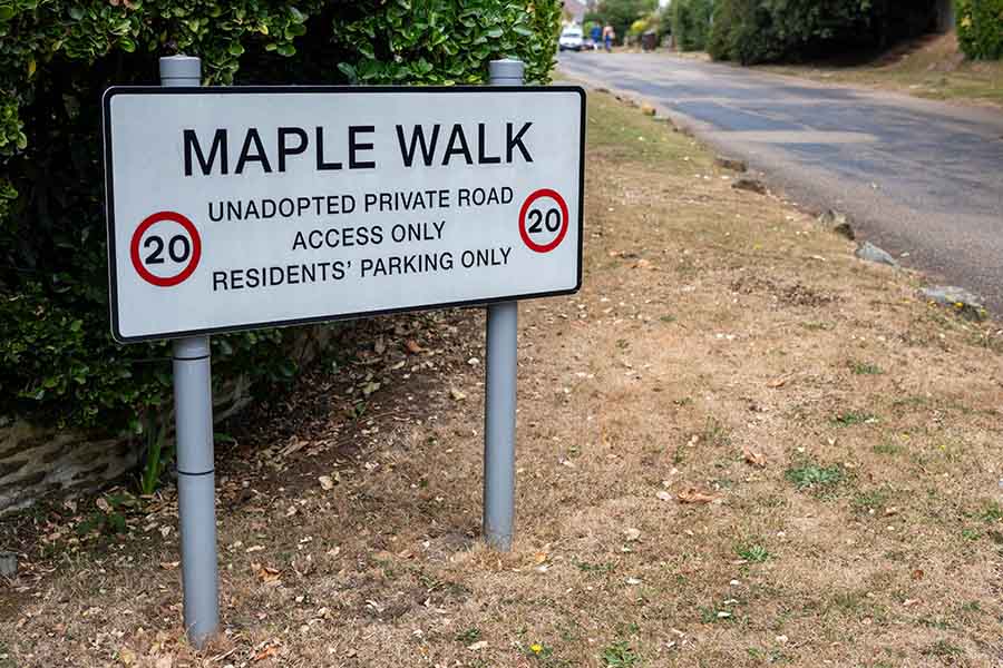 A street sign of an unadopted road