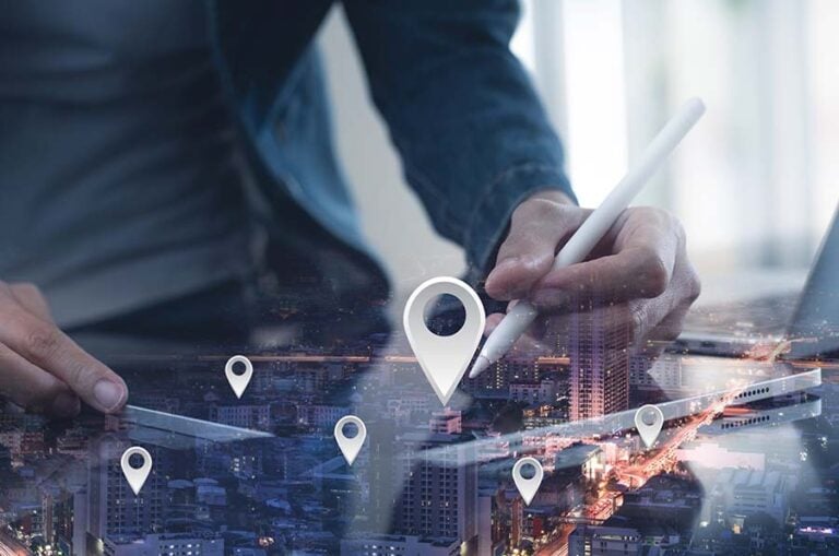 GPS map, pin address location on mobile apps. Double exposure of man hand using digital tablet searching target place on night cityscape while working on tablet